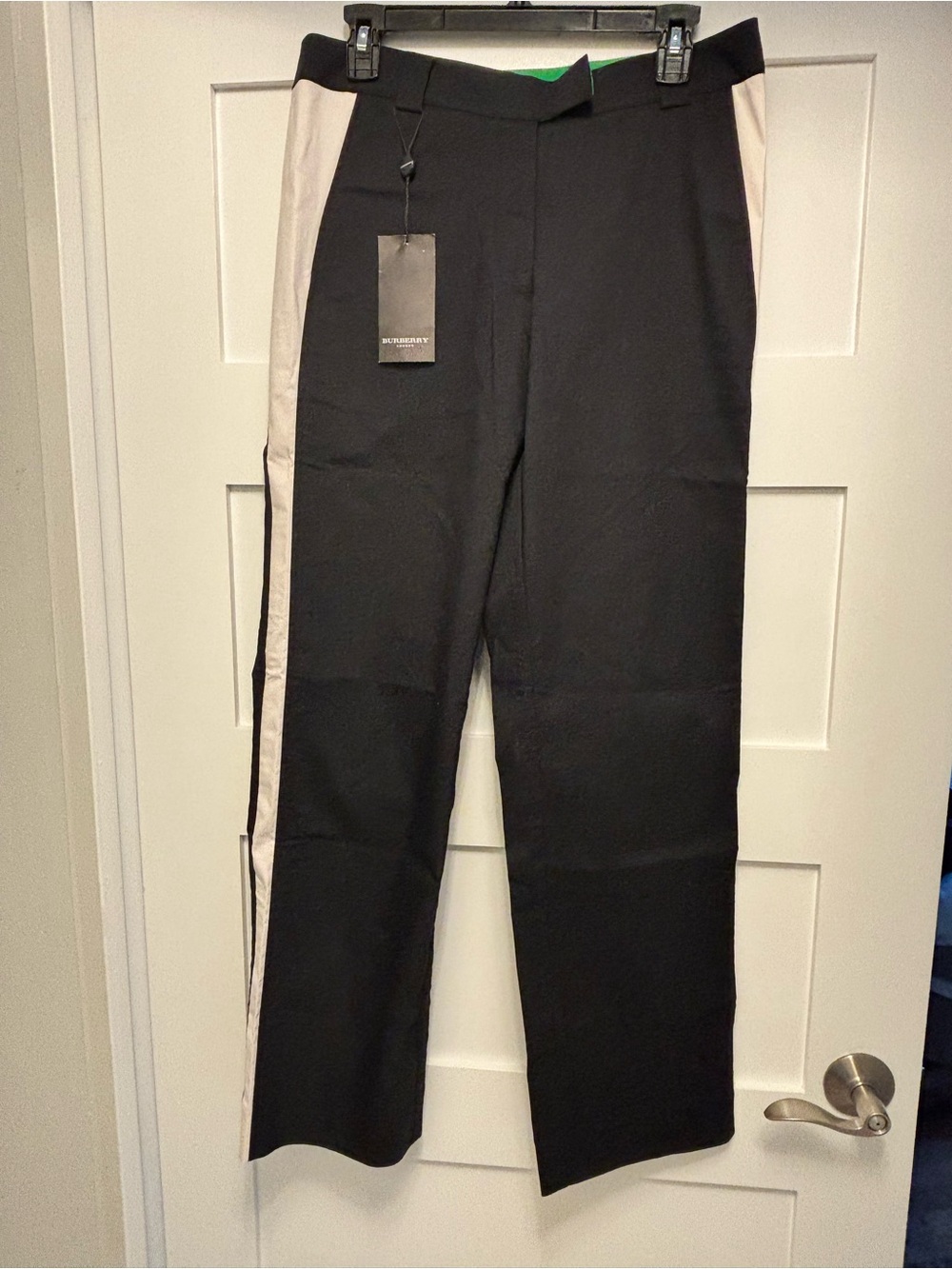 Burberry golf pants women. New with tags. Navy blue and white stripe on side.